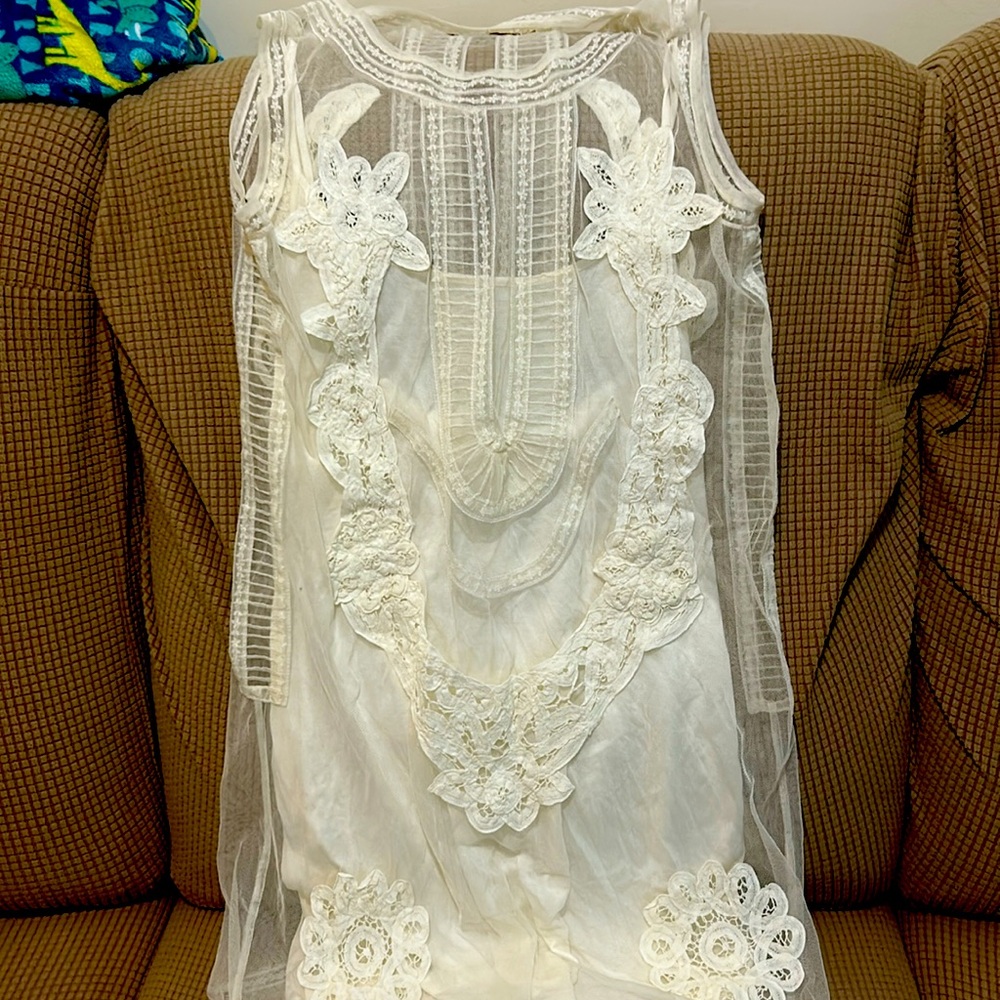 Candela designer lace with a slip under above the knees no sleeve